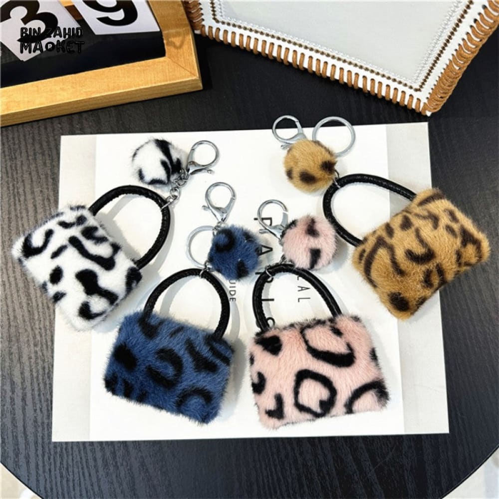 LEOPARD PATTERN BAG KEYCHAIN WITH FLUFFY BEAD — BACKPACK PHONE & CAR ACCESSORY