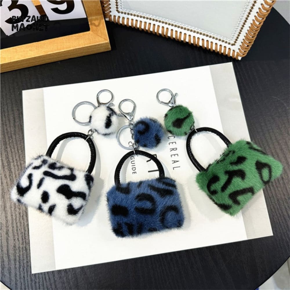 LEOPARD PATTERN BAG KEYCHAIN WITH FLUFFY BEAD — BACKPACK PHONE & CAR ACCESSORY