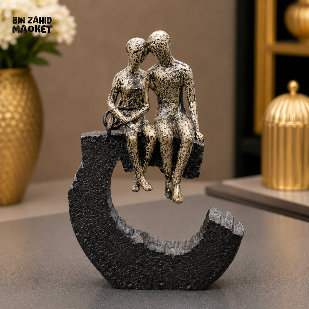 ANTIQUE GOLD COUPLE ON CRESCENT DECORATIVE SCULPTURE