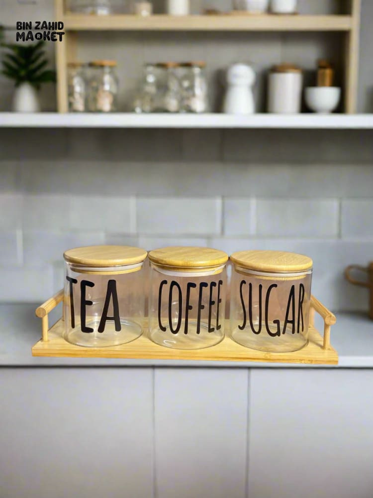 CLEAR GLASS JARS WITH BAMBOO LIDS FOR TEA COFFEE AND SUGAR ON A BAMBOO TRAY — SIMPLE AND STYLISH