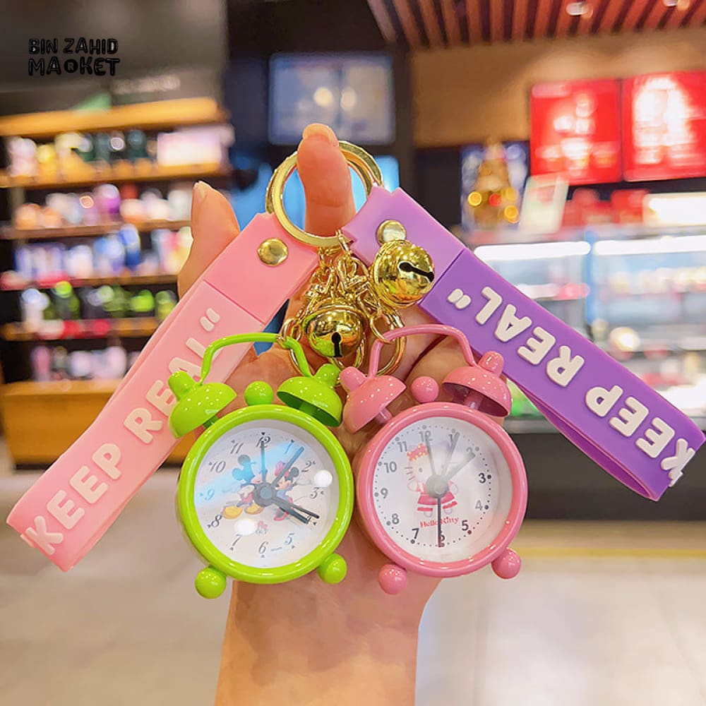 COLORFUL MINI ALARM CLOCK KEYCHAIN WITH "KEEP REAL" STRAP – CUTE CARTOON DESIGN ACCESSORY
