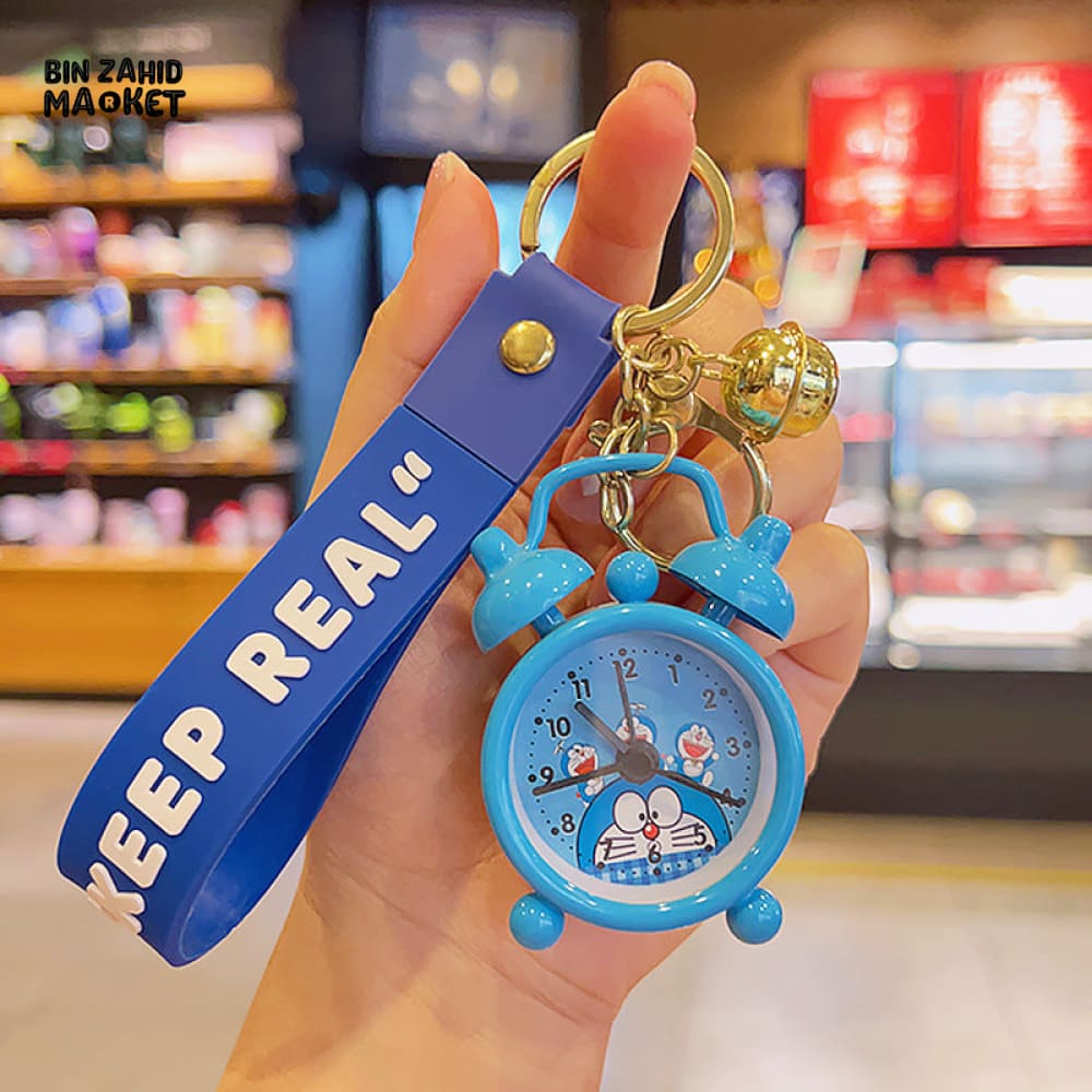 COLORFUL MINI ALARM CLOCK KEYCHAIN WITH "KEEP REAL" STRAP – CUTE CARTOON DESIGN ACCESSORY