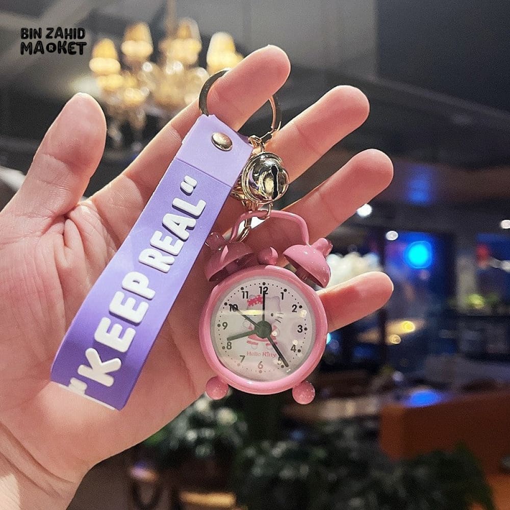 COLORFUL MINI ALARM CLOCK KEYCHAIN WITH "KEEP REAL" STRAP – CUTE CARTOON DESIGN ACCESSORY