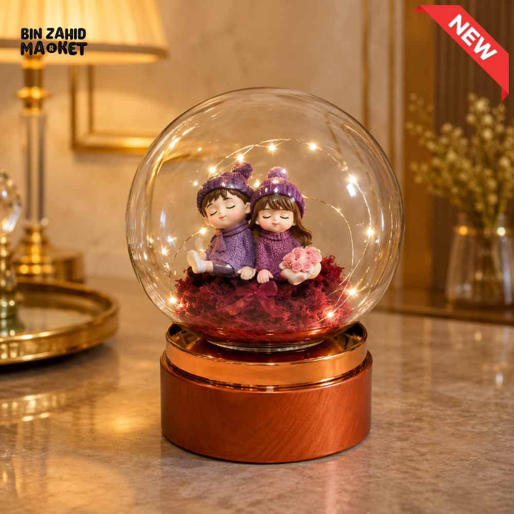 DECORATIVE COUPLE GLASS GLOBE LED TABLE LAMP WITH ROSE GOLD BASE