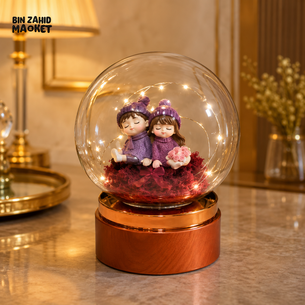 DECORATIVE COUPLE GLASS GLOBE LED TABLE LAMP WITH ROSE GOLD BASE