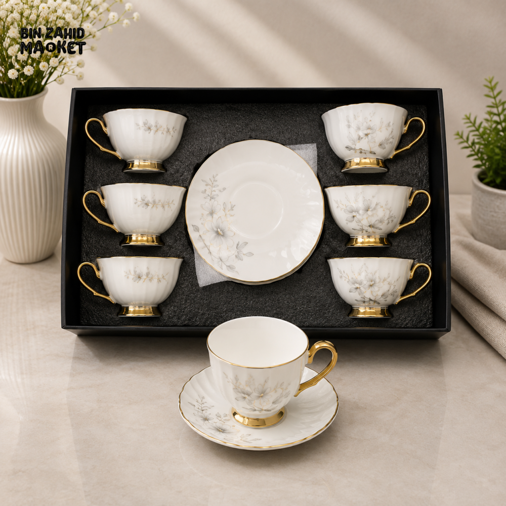 FLORAL WHITE PORCELAIN TEA CUP AND SAUCER SET WITH GOLD TRIM