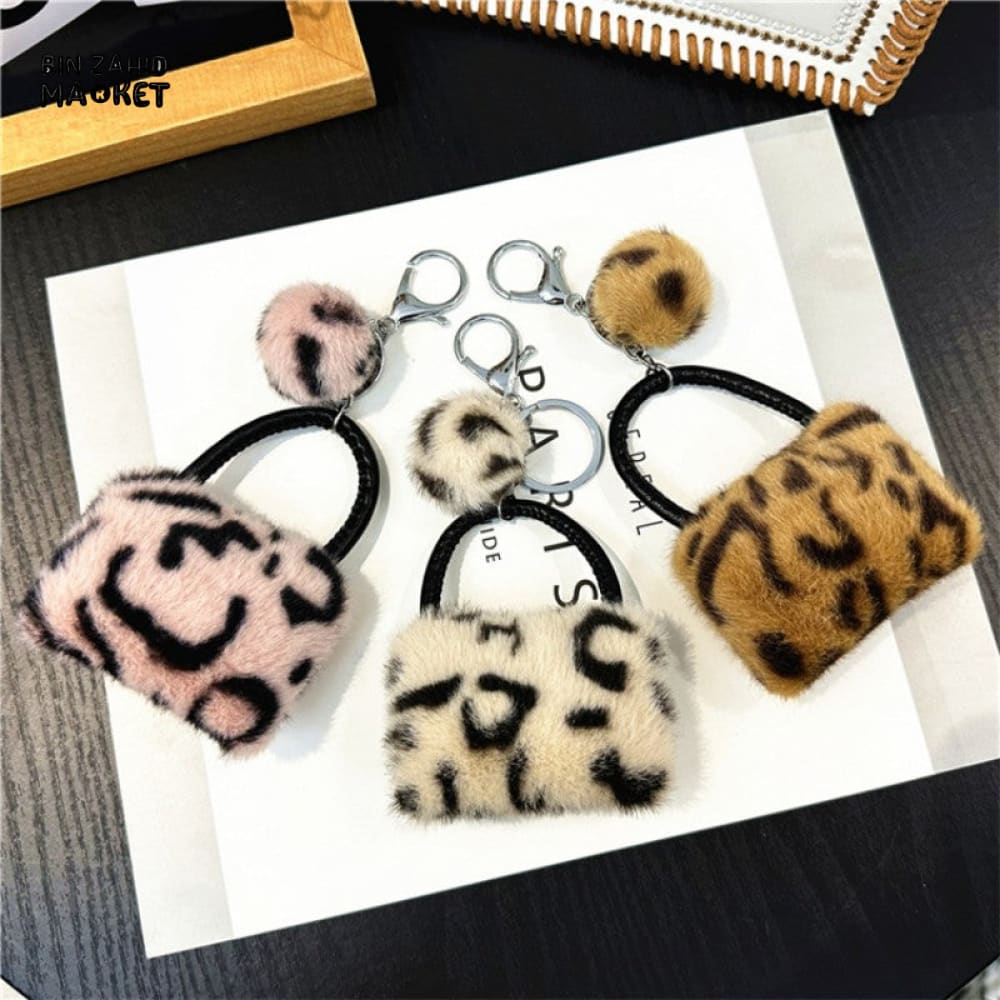 LEOPARD PATTERN BAG KEYCHAIN WITH FLUFFY BEAD — BACKPACK PHONE & CAR ACCESSORY