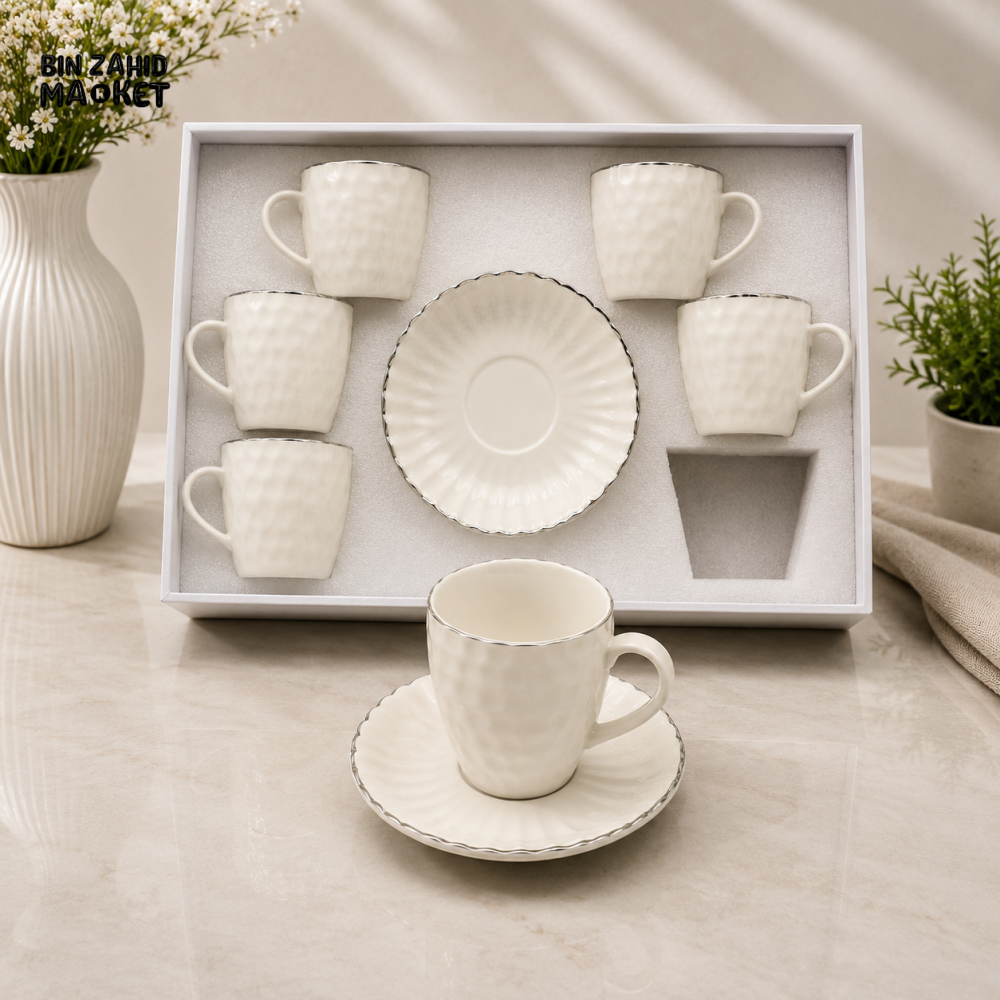 TEXTURED WHITE PORCELAIN TEA CUP AND SAUCER SET WITH SILVER TRIM
