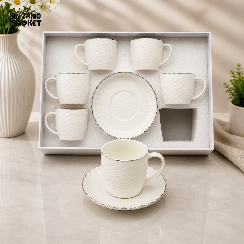 TEXTURED WHITE PORCELAIN TEA CUP AND SAUCER SET WITH SILVER TRIM