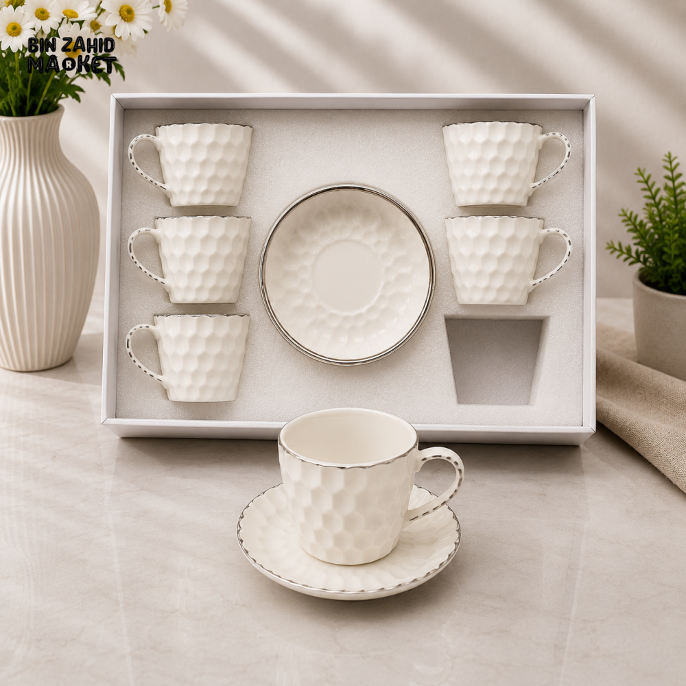 TEXTURED WHITE PORCELAIN TEA CUP AND SAUCER SET WITH SILVER TRIM